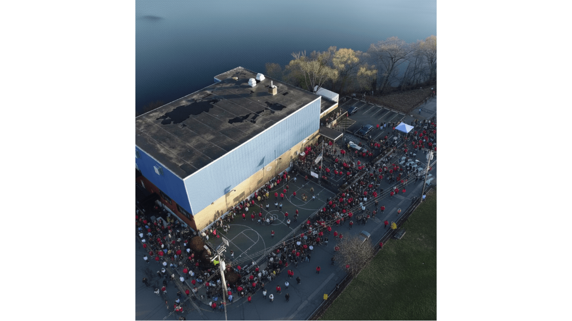 Aerial view of the Arlington Boys & Girls Club court with hundreds of community members